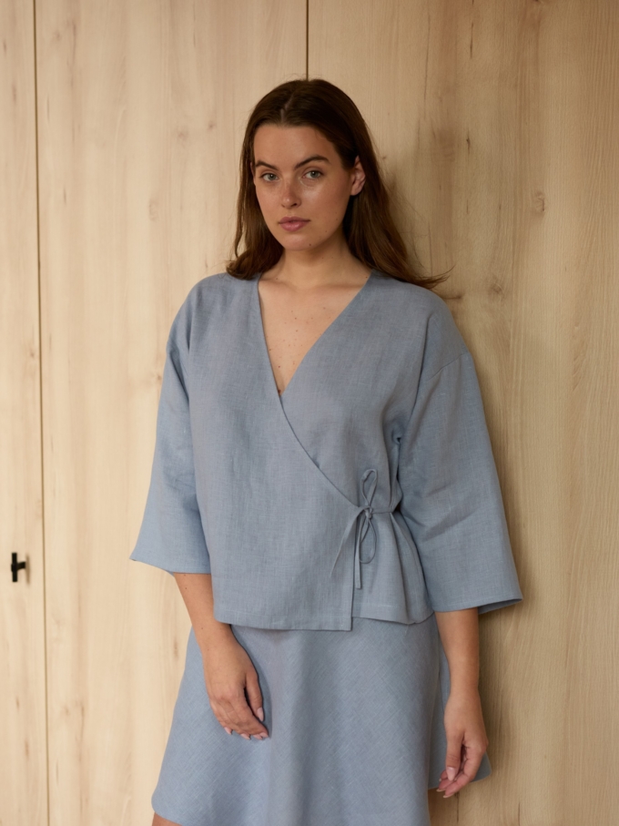 Image 1 of SOFIA linen kimono wrap top in Vista Blue, featuring a side tie closure and wide 3/4 sleeves, from Love and Confuse.