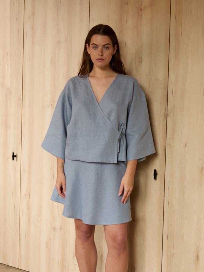 Image 4 of SOFIA linen kimono wrap top in Vista Blue, featuring a side tie closure and wide 3/4 sleeves, from Love and Confuse.