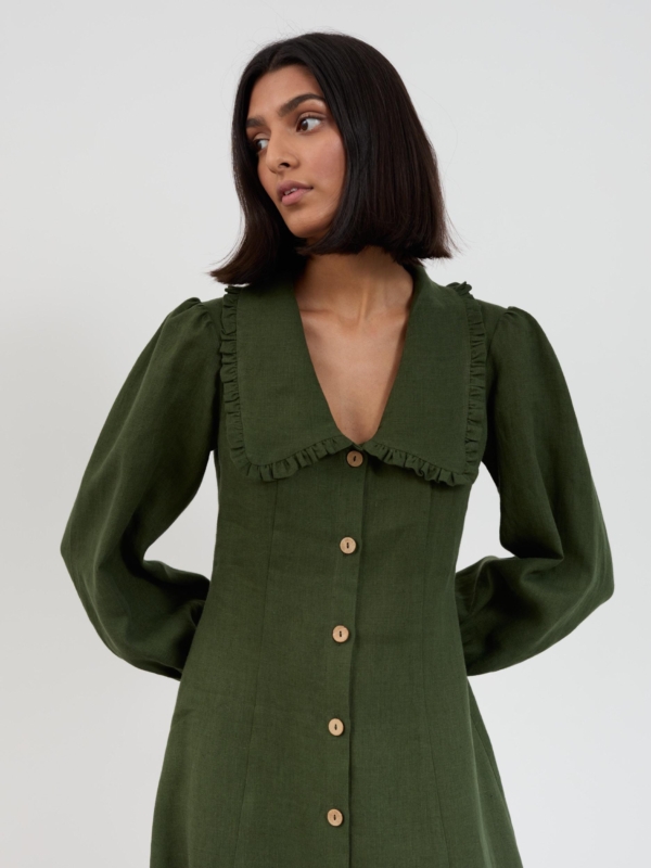 Front view of the Aubrey linen midi dress in forest green showing ruffled collar, button front and puff sleeves