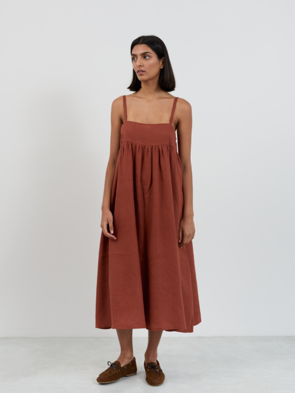 Linen midi sundress with wide straps and square neckline, empire waist with gathered skirt, front view
