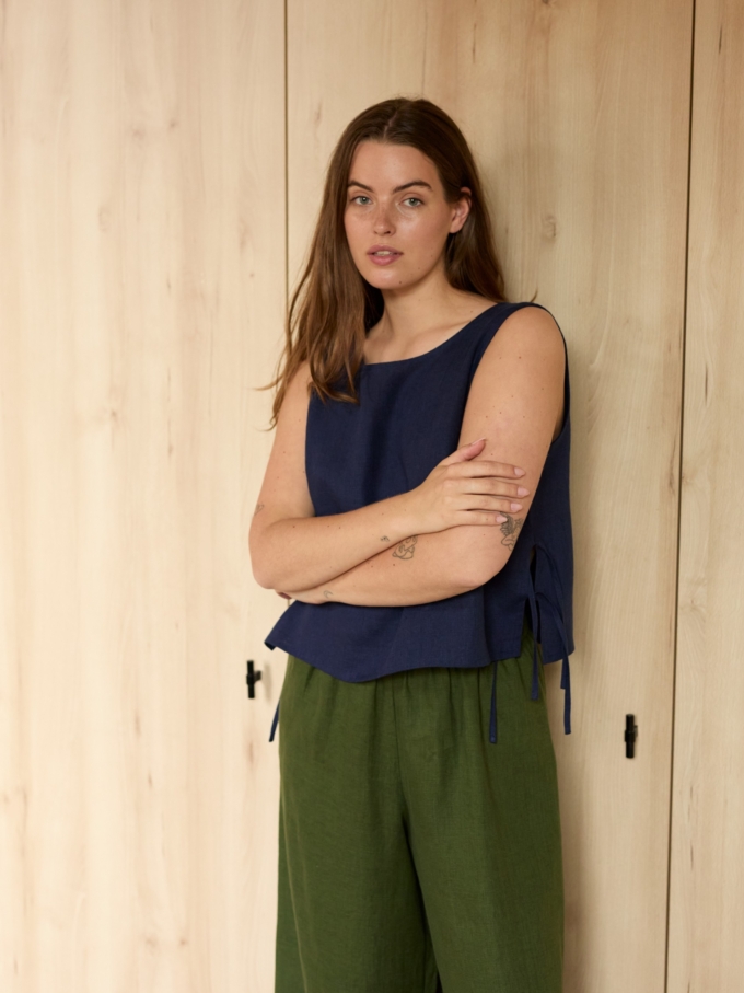 Image 1 of AVERY linen tank top in Navy Blue, featuring adjustable side ties and a scoop neckline, from Love and Confuse.